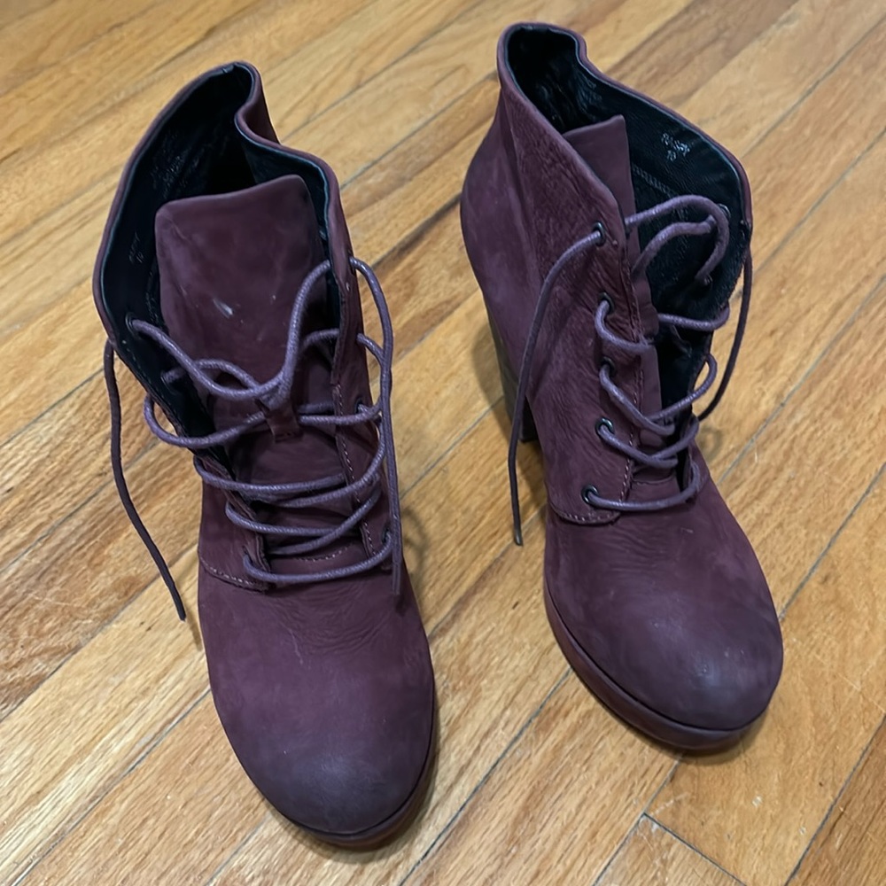 Woman’s leather ankle laced platform boots with 4 inch heel.